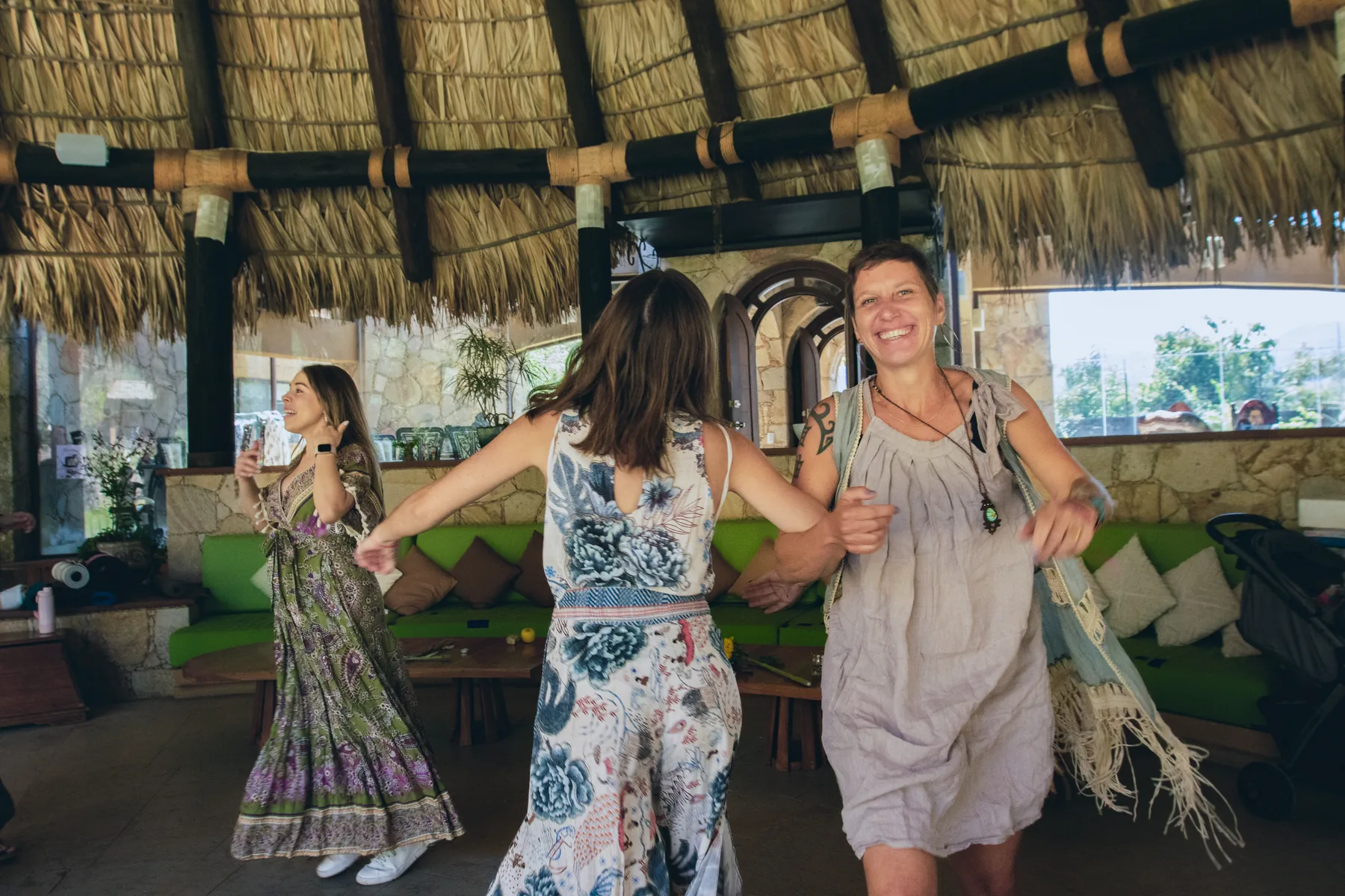 Leila dancing with other women during a gathering